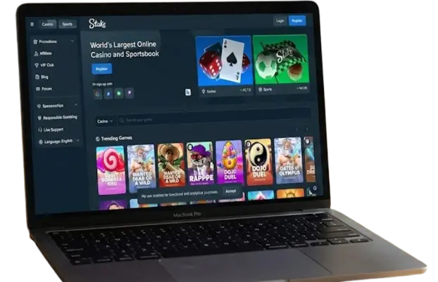 A MacBook Pro on a table with Stake Casino open on the screen